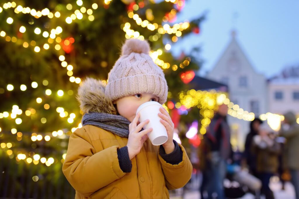 winter family activities sipping hot cocoa while looking at Christmas lights